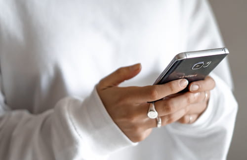 Hands holding phone